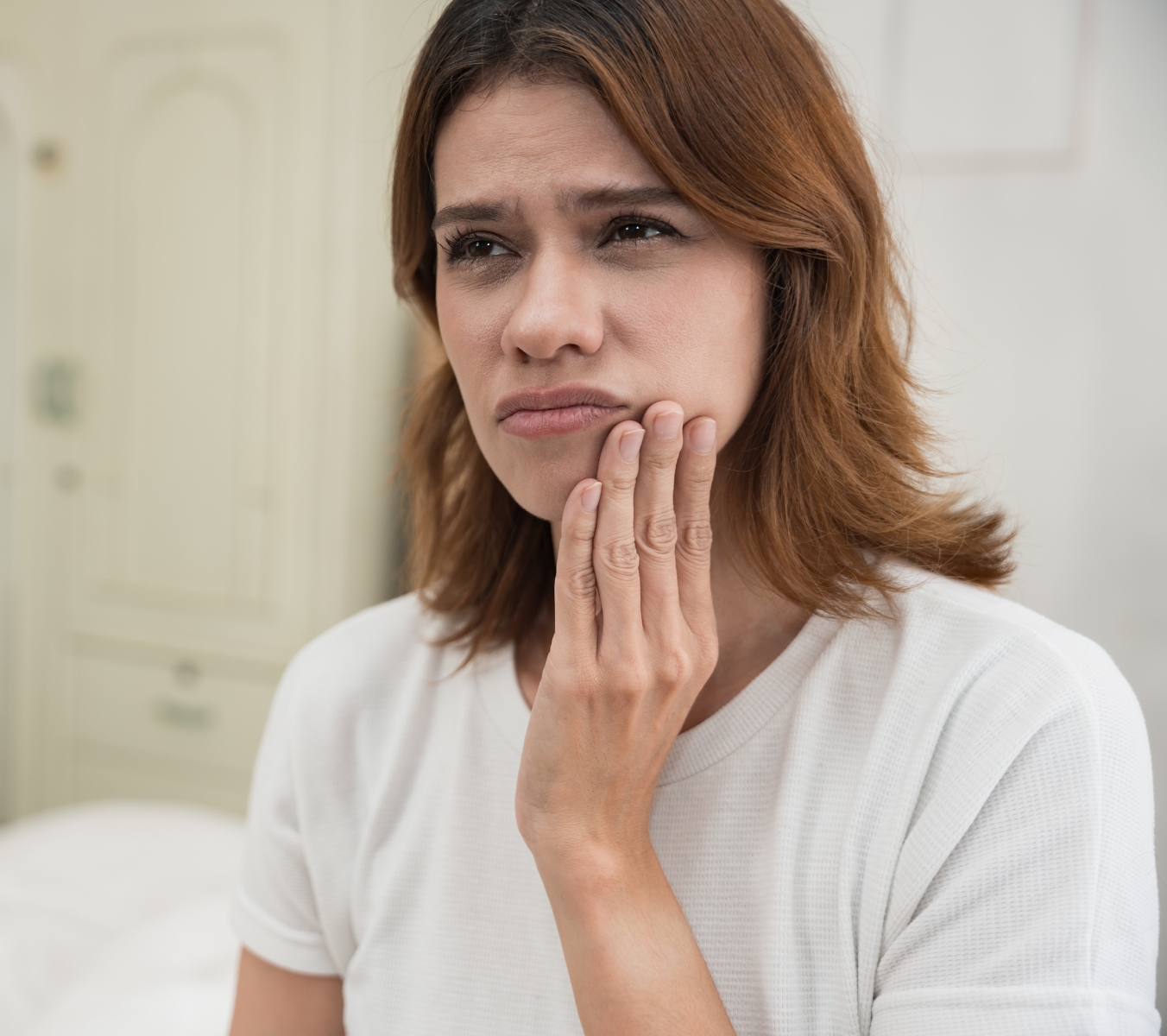 Why might a tooth need to be extracted?